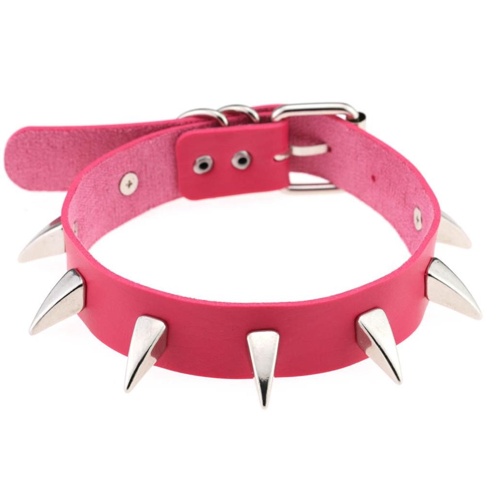Pink leather choker necklace with silver spikes, perfect for a rock-inspired look, adjustable size for unisex wear.