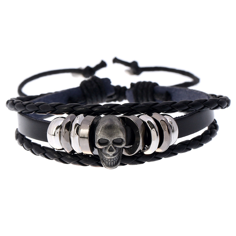 Multi-layer leather skull bracelet for men and women, stylish rock-style accessory in black.