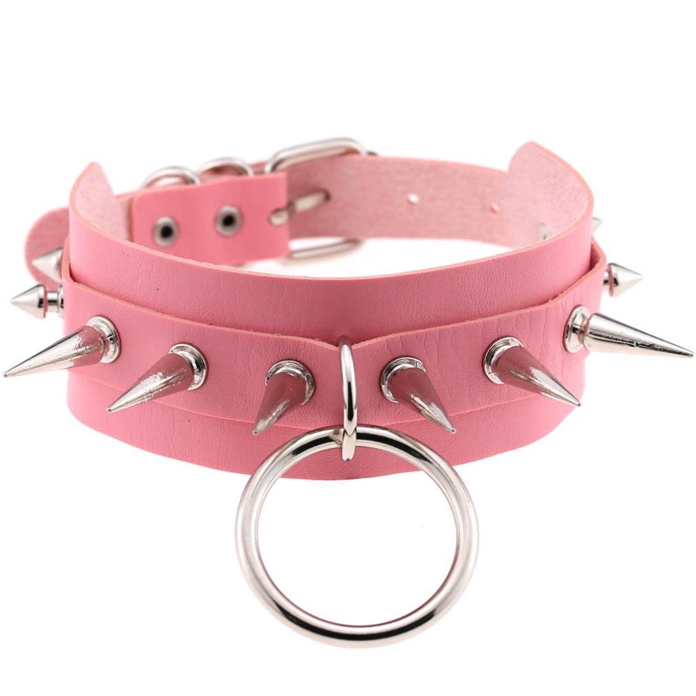 Pink leather choker with spike rivets and O-ring, perfect for a rock style look, adjustable size.