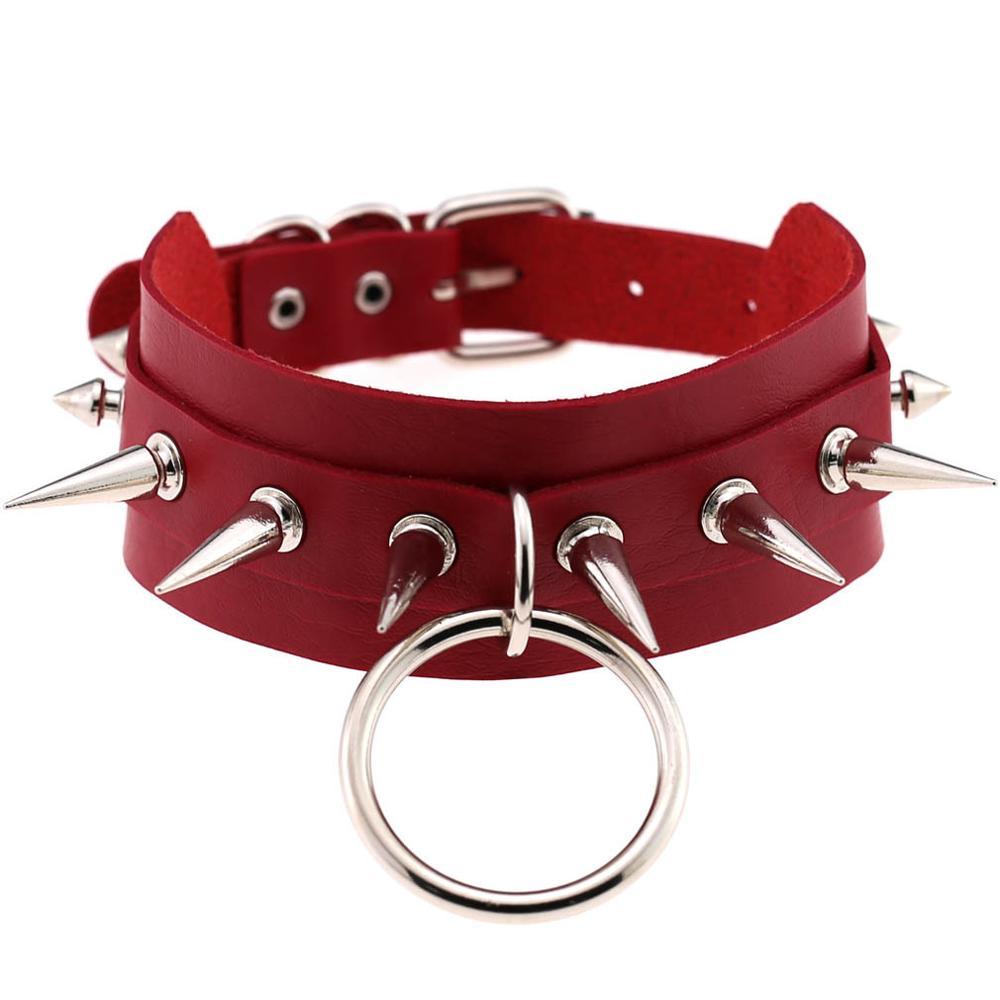Red leather rock choker with spike rivets and metal ring, ideal for bold fashion statements.