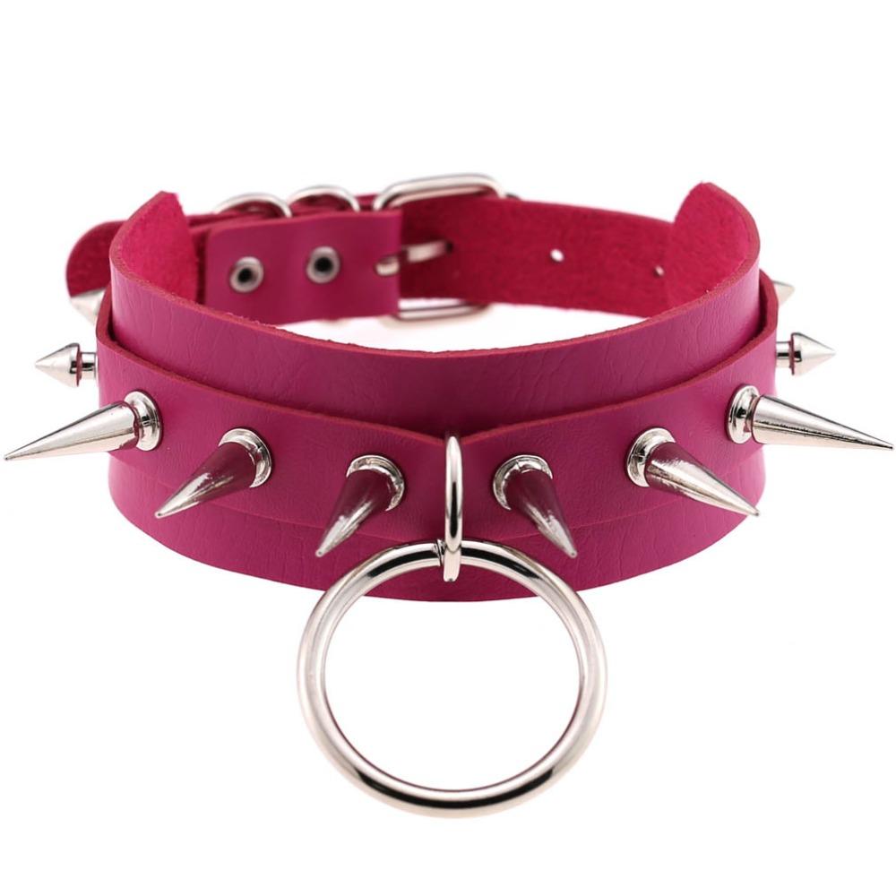 Pink leather choker with silver spike rivets and metal ring, perfect for a rock style look.
