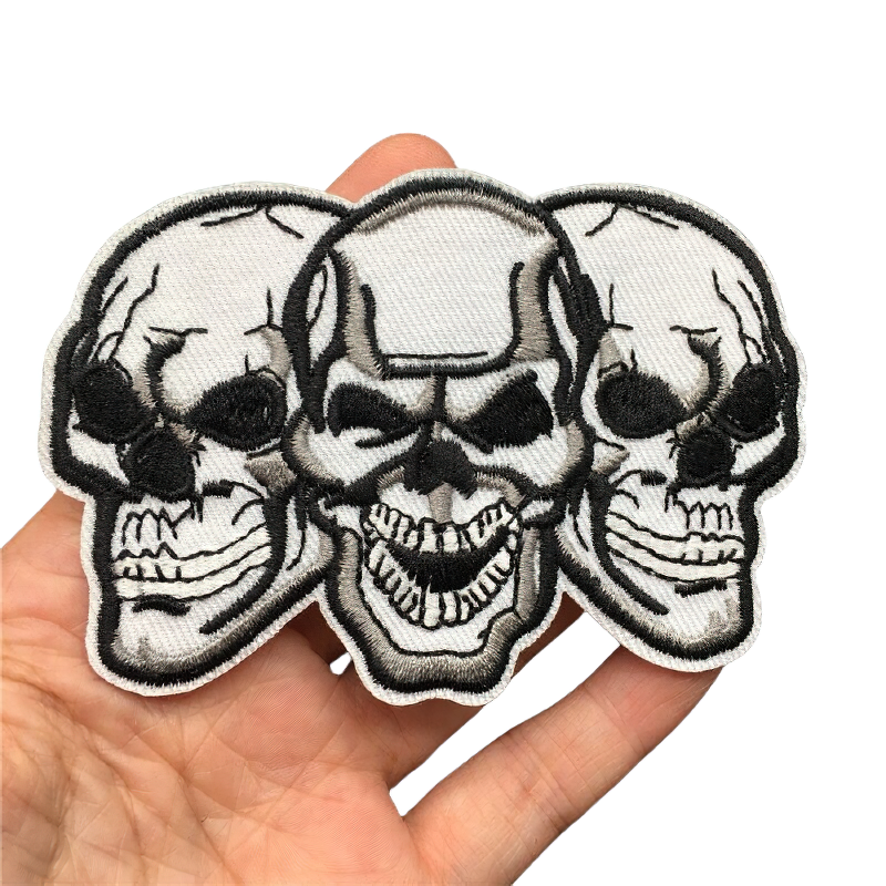 Unisex rock style patch with three gothic skulls, perfect for adding edgy flair to clothing.