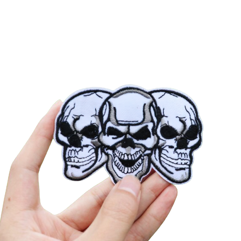 Unisex rock style patch featuring three gothic skulls, perfect for adding an edgy touch to clothing and accessories.