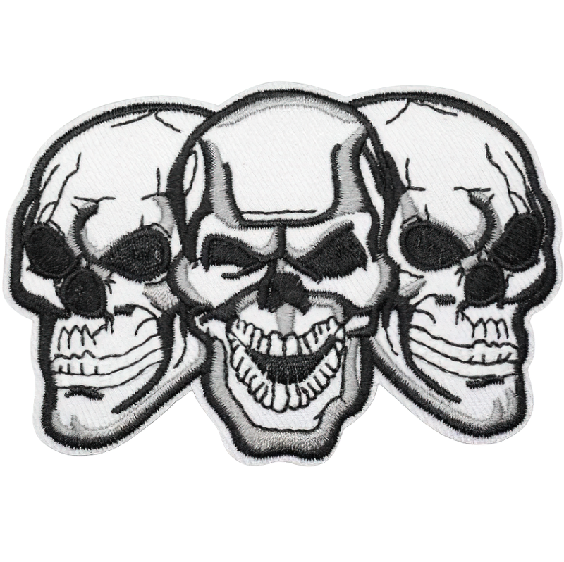 Gothic skull patch featuring three intricately designed skulls, perfect for rock style clothing and alternative fashion.