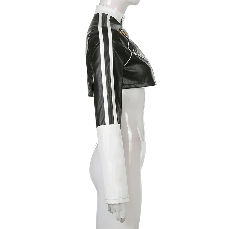 Side view of women's cropped PU leather patchwork jacket in black and white, showcasing alternative fashion style.