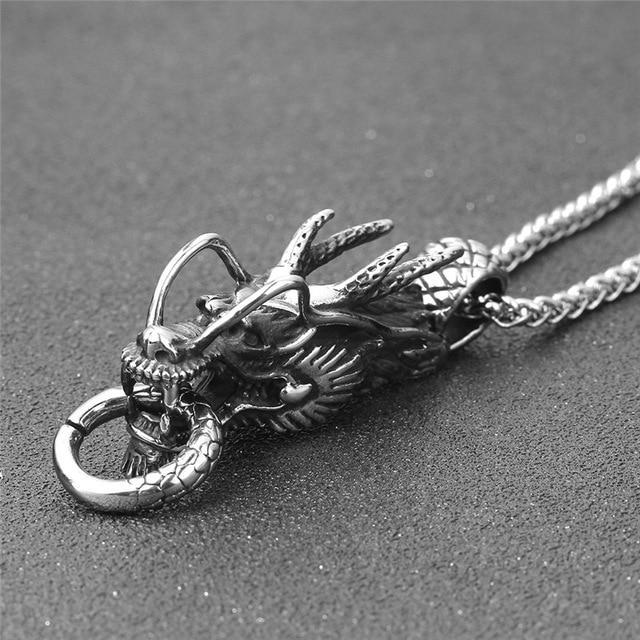 Gold and silver dragon pendant necklace made of stainless steel, perfect for cosplay and festivals, showcasing a fierce dragon design.