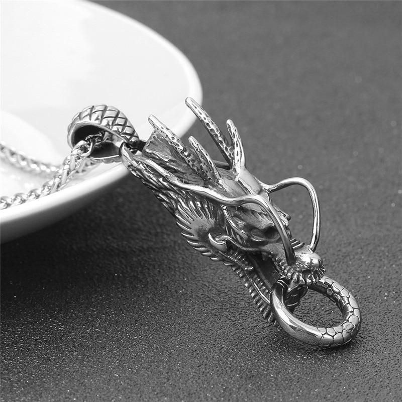 Intricate gold and silver dragon pendant necklace made of stainless steel, perfect for cosplay and rock festivals.