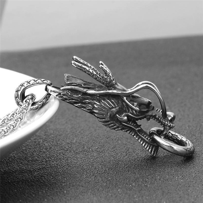Intricate silver dragon pendant necklace showcasing detailed craftsmanship, perfect for trendy accessories.