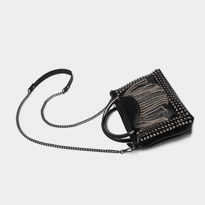 Stylish rock-inspired crossbody bag for women, featuring chains, studs, and a unique design.