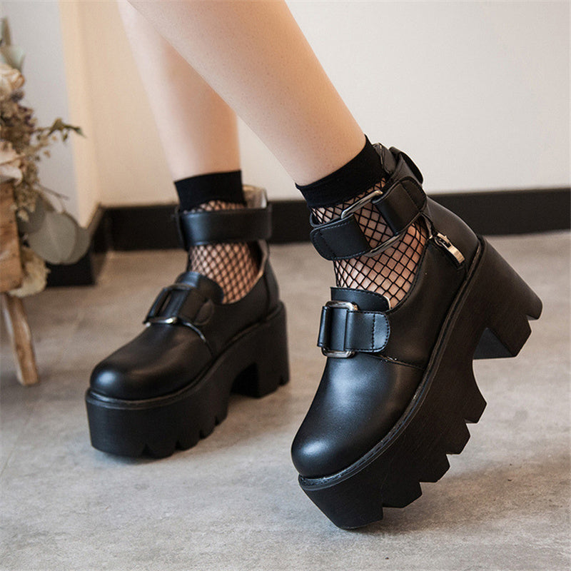 Women's black chunky pumps with straps and fishnet socks, perfect for gothic fashion and versatile styling.