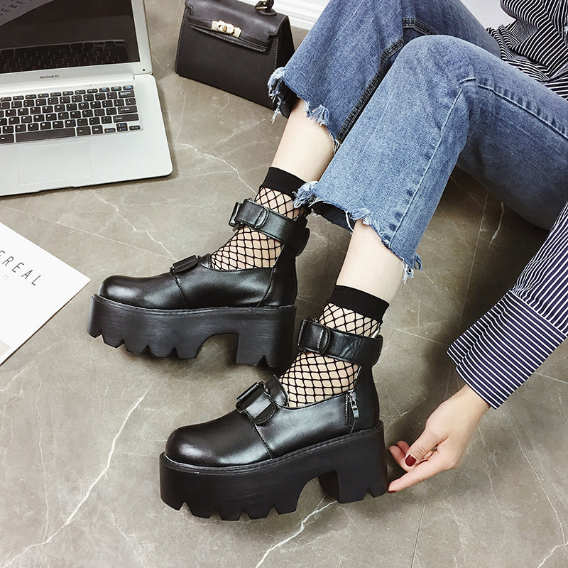 Women's Gothic chunky pumps with buckle detail and fishnet socks, perfect for rock style outfits.