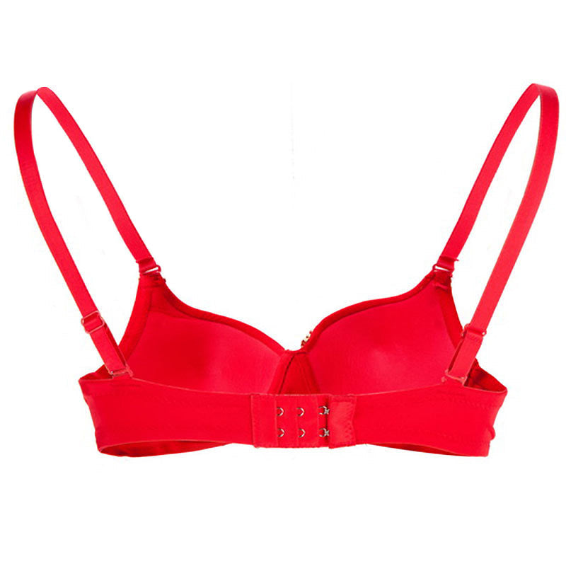 Red push-up bra featuring a stylish design with comfortable straps and secure closure for added support.