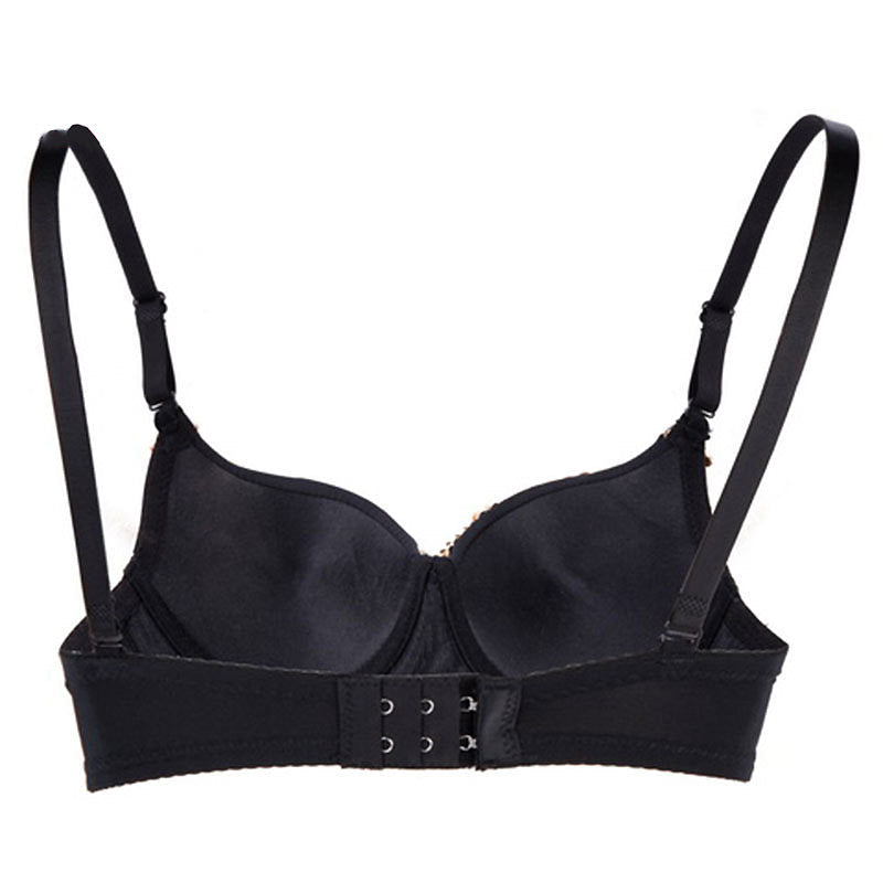 Black push-up bra with adjustable straps and hook closure, perfect for rock and goth styles.