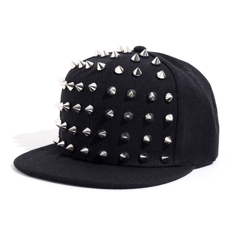 Rock style snapback cap with silver and black spikes, perfect accessory for punk fashion or festivals.