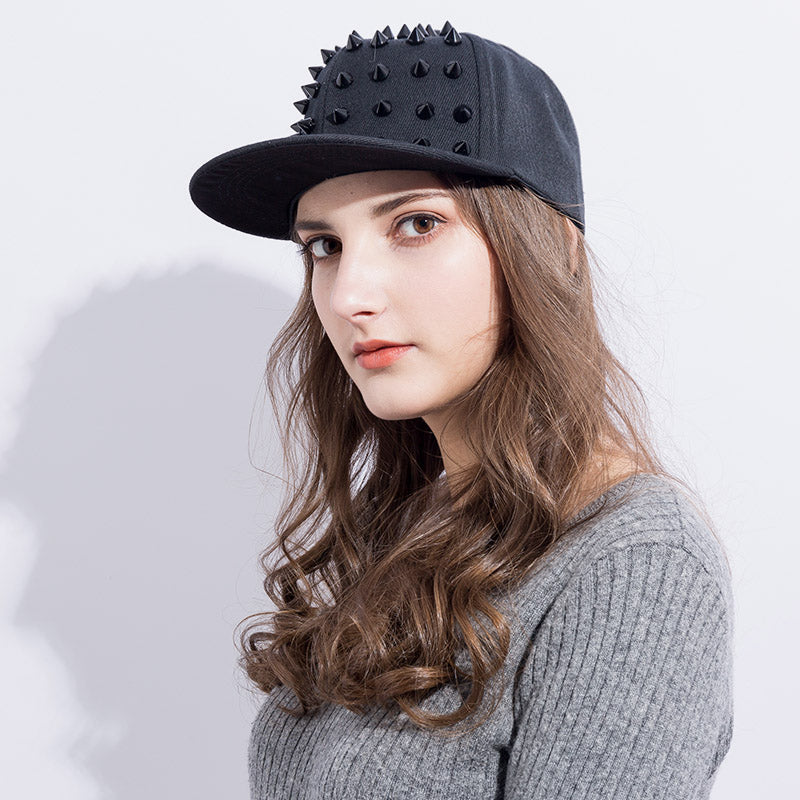 Stylish rock style snapback hat with black spikes, perfect for adding flair to your festival outfit.