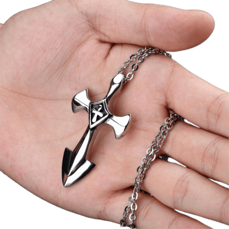 Rock style stainless steel cross pendant held in hand, showcasing unique design and 50cm link chain, perfect for unisex fashion.