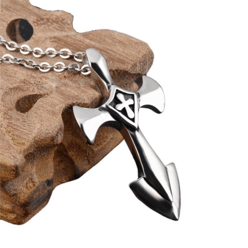 Rock style stainless steel cross pendant with link chain on wooden background, perfect for unisex fashion.