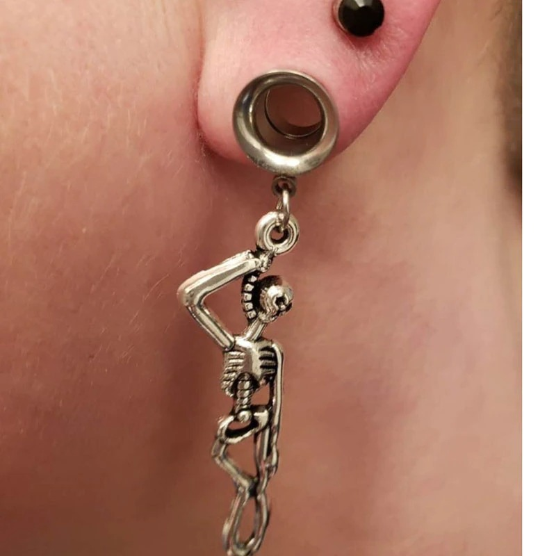 Rock style stainless steel earrings featuring a skeleton design, perfect for unisex fashion enthusiasts.