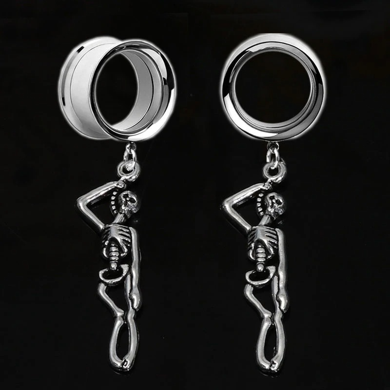 Rock style unisex stainless steel skull tunnels earrings with skeleton design, perfect for adding edge to your outfit.