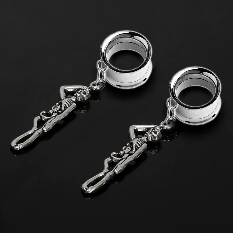 Stylish unisex stainless steel skull tunnels earrings with skeleton design, perfect for rock fashion lovers.
