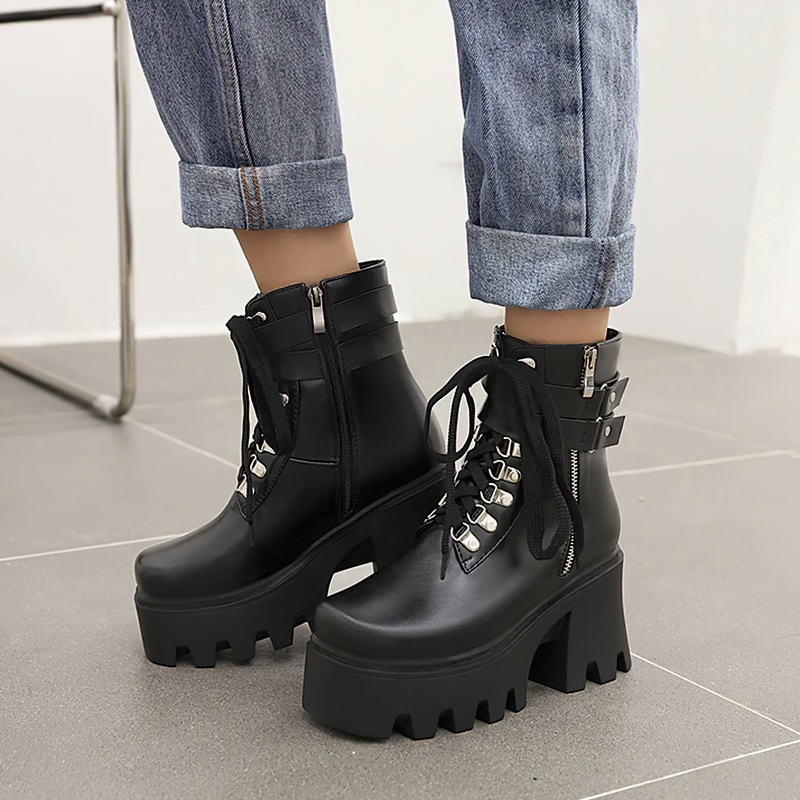 Trendy black lacing motorcycle platform boots with chunky heels, perfect for rock style outfits.