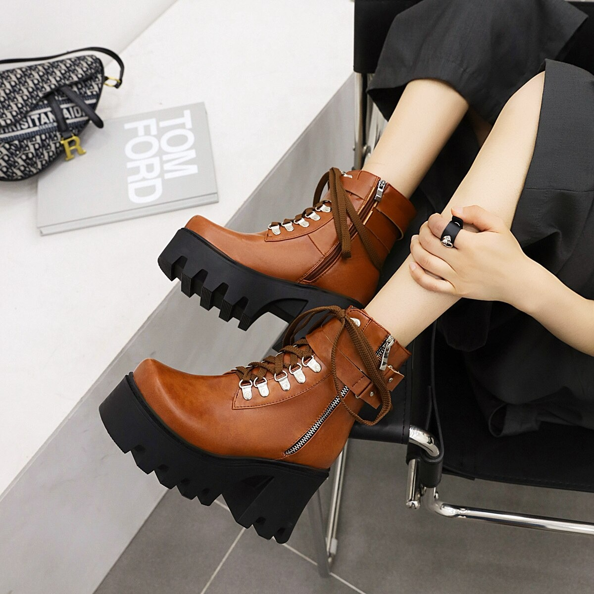 Brown lacing platform motorcycle boots with buckles and thick heels, perfect for rocker outfits and stylish looks.