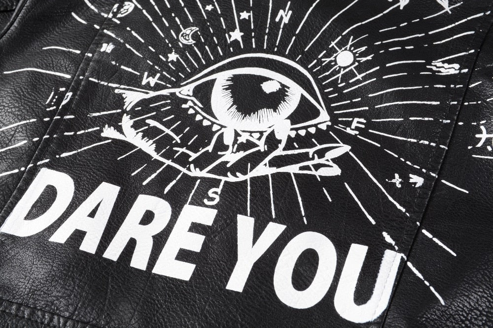 Close-up of unique 3D printed eye design on faux leather jacket featuring the phrase 'DARE YOU' in bold.