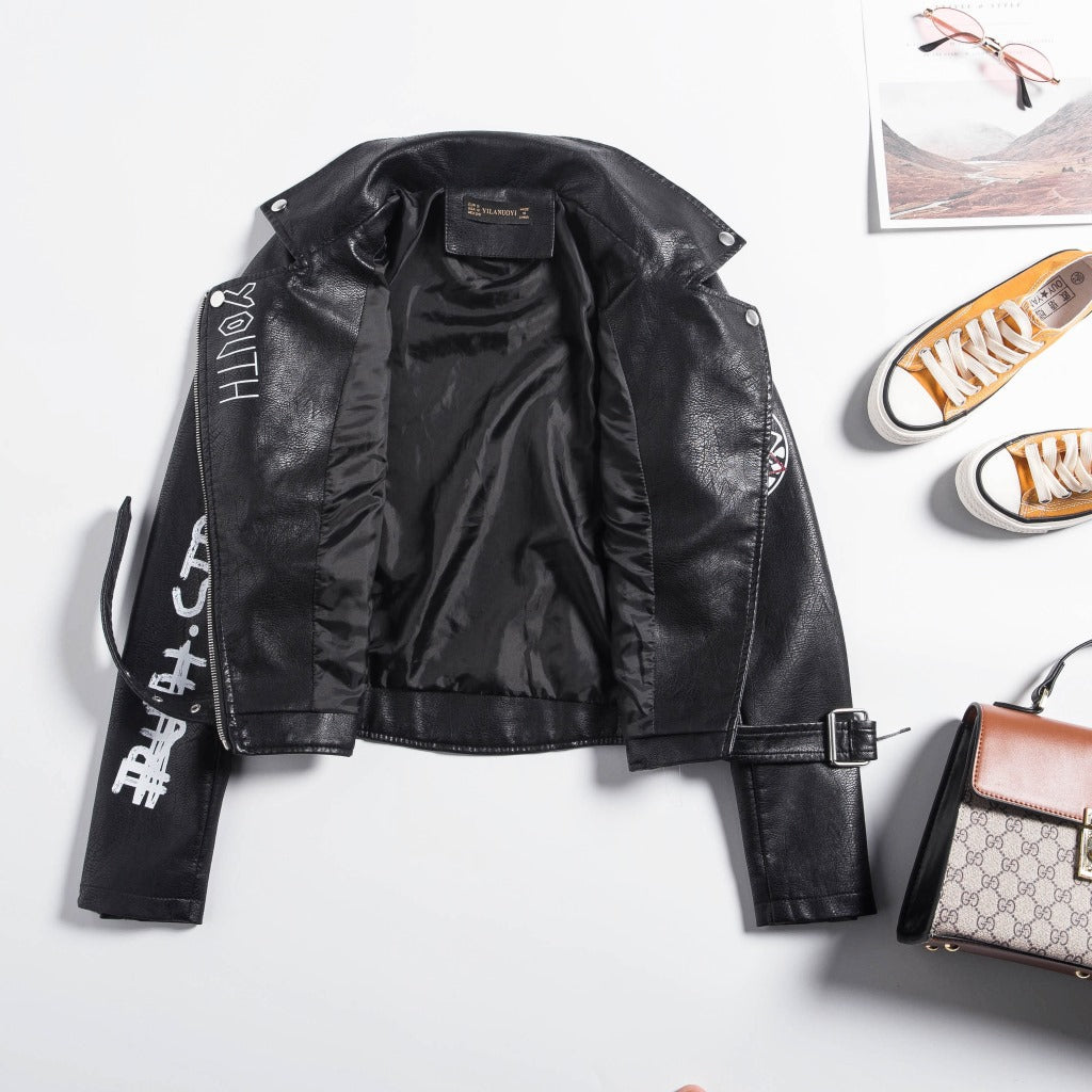 Stylish women's faux leather motorcycle jacket with unique 3D prints and edgy studs, perfect for rock or goth looks.