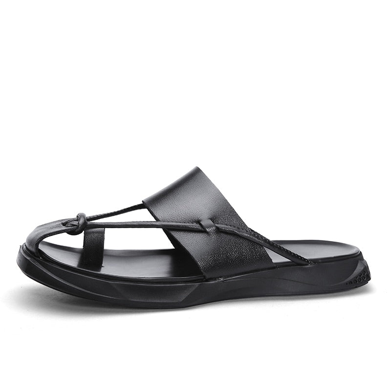 Rock'n'Roll style men sandals in black genuine leather, featuring a slip-on design for casual beach wear.