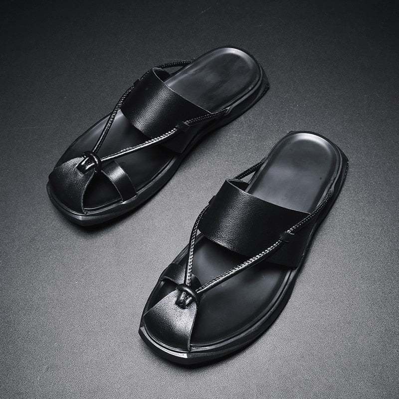 Rock'n'Roll style men sandals in black genuine leather with ankle-wrap, perfect casual beach footwear.