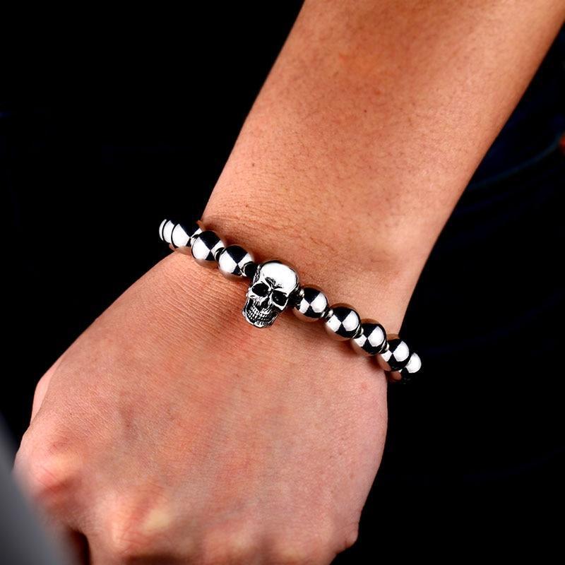 Stylish round bead rock skull bracelet in stainless steel, perfect for adding a cool touch to any outfit.