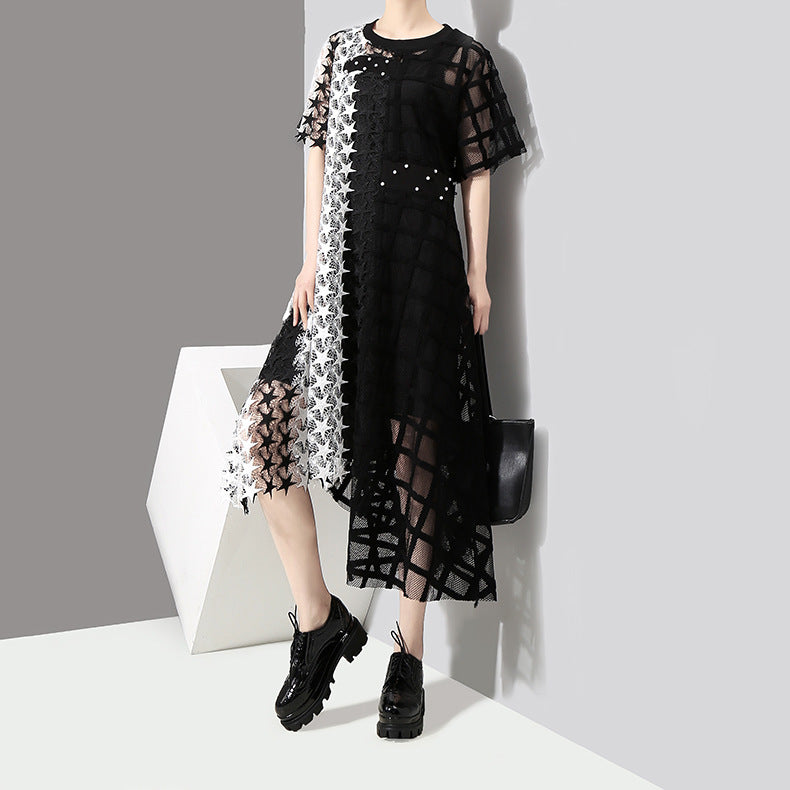 Women's black and white irregular loose gothic dress with star patterns and short sleeves, perfect for spring outings.