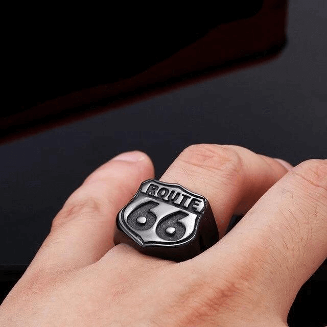Route 66 rock style stainless steel ring on a finger, perfect for biker accessories and road adventure lovers.