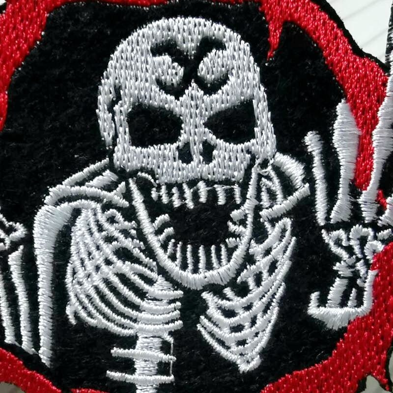Scary skull patch design with red accents, perfect for adding rock-style flair to jackets and bags.