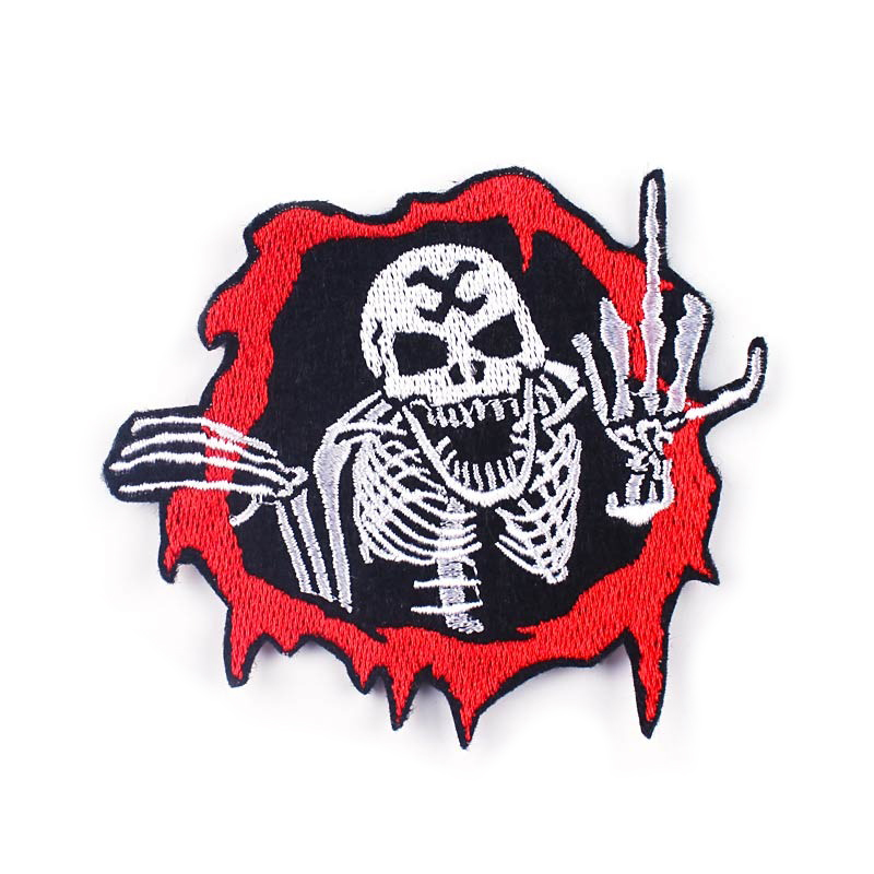 Cool skull print fusible patch with skeleton giving the middle finger, perfect for rock-themed jackets and bags.
