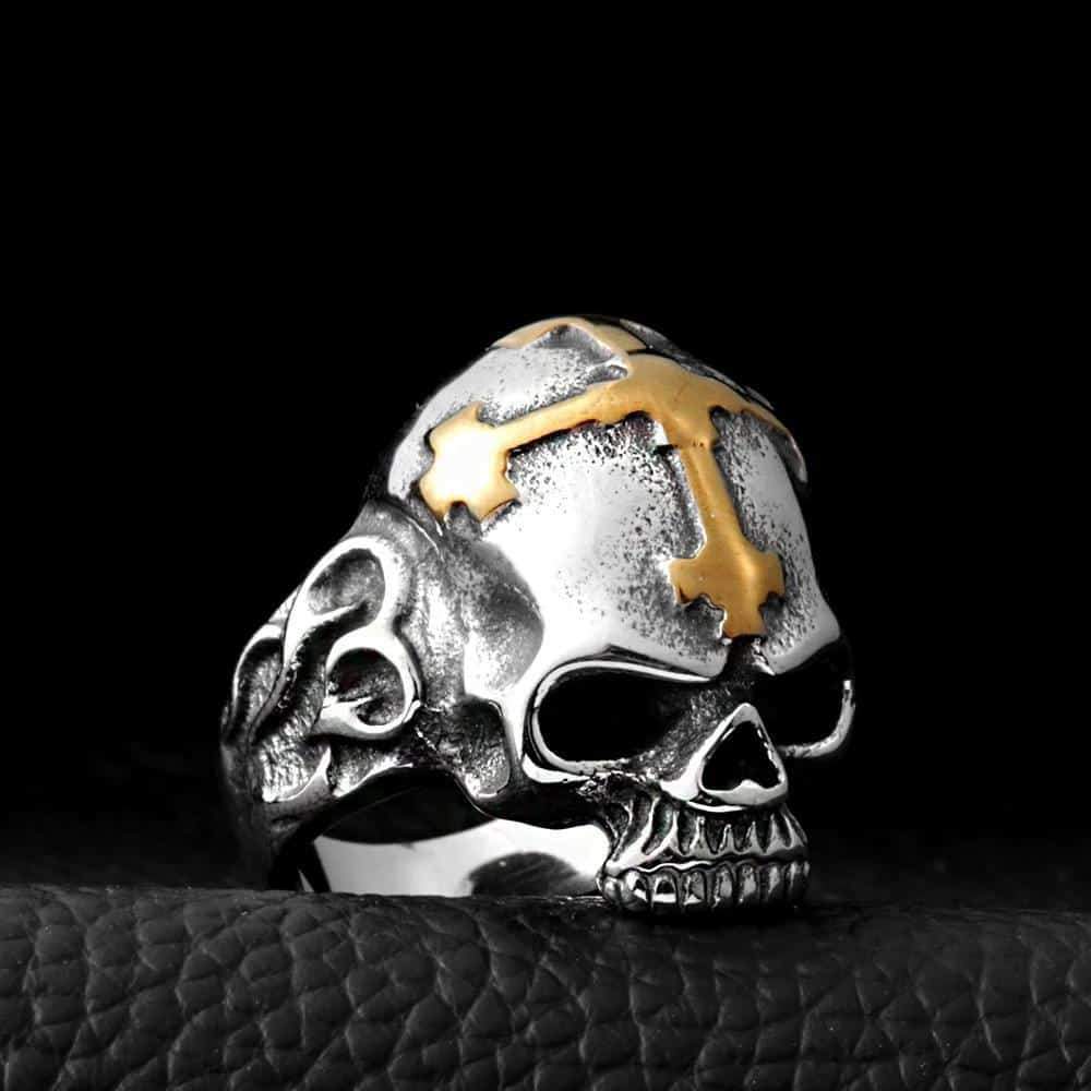 Scary stainless steel skull ring with gold cross, perfect for rock-style jewelry lovers and bold accessories.