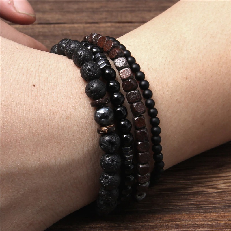 Unisex set of natural stone and wood bead bracelets in black and brown tones, stylish accessory for any outfit.