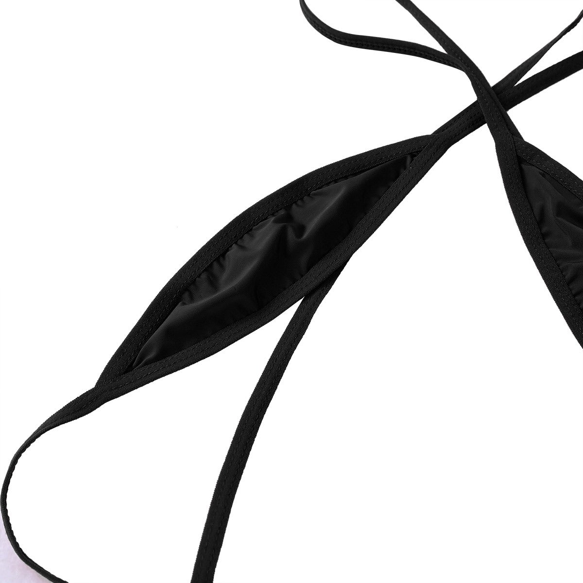 Close-up of black backless slingshot underwear featuring criss-cross straps and soft fabric, perfect for a sexy beach look.