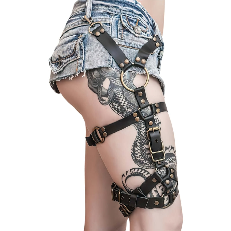 Bold leather body harness for women, featuring metal accents for edgy fashion and alternative styles.