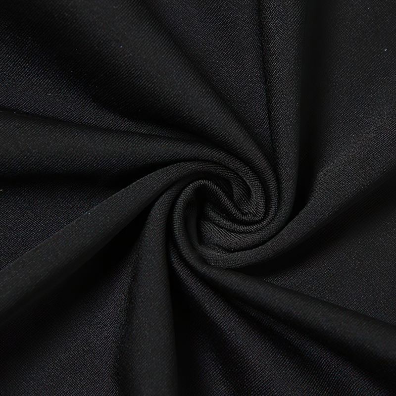 Close-up of soft black fabric ideal for sexy bodysuits, showcasing its smooth texture and stretchability.