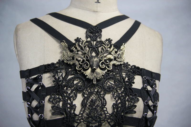 Elegant black lace chest harness with gothic design and ornate metal centerpiece for women.
