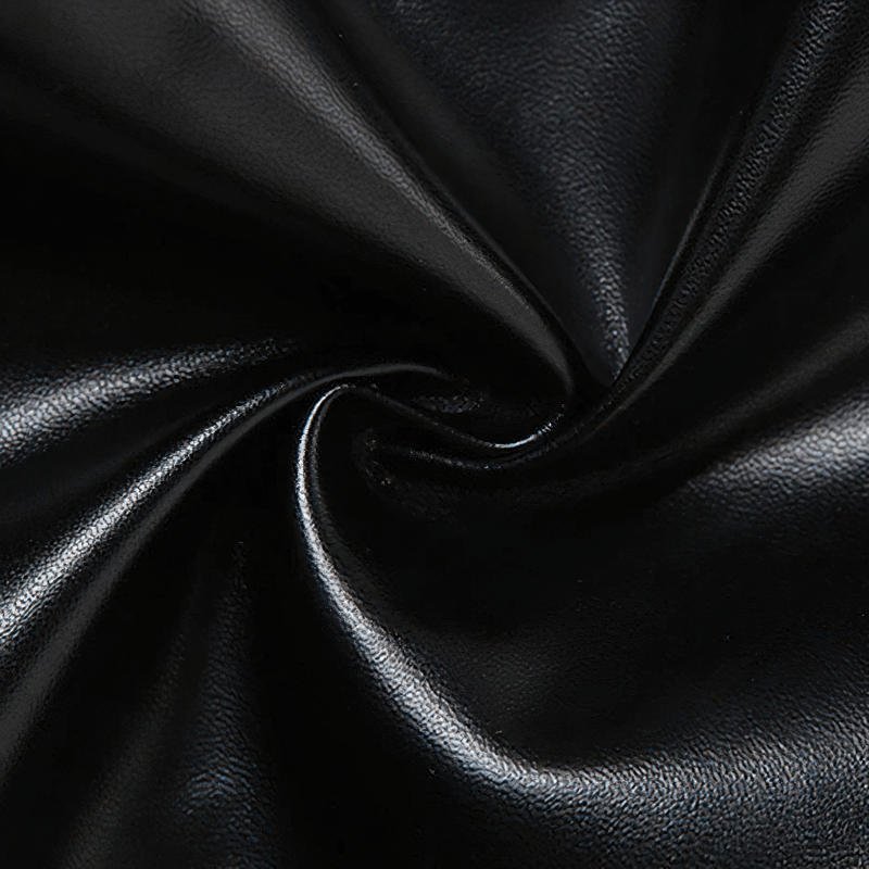 Close-up of smooth black fabric, perfect for stylish women's cropped tank tops in rock fashion.