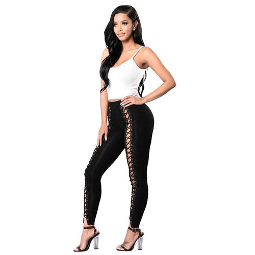 Leggings negros sexis con cordones y agujeros/pantalones de tubo ajustados huecos de cintura alta en estilo rock
