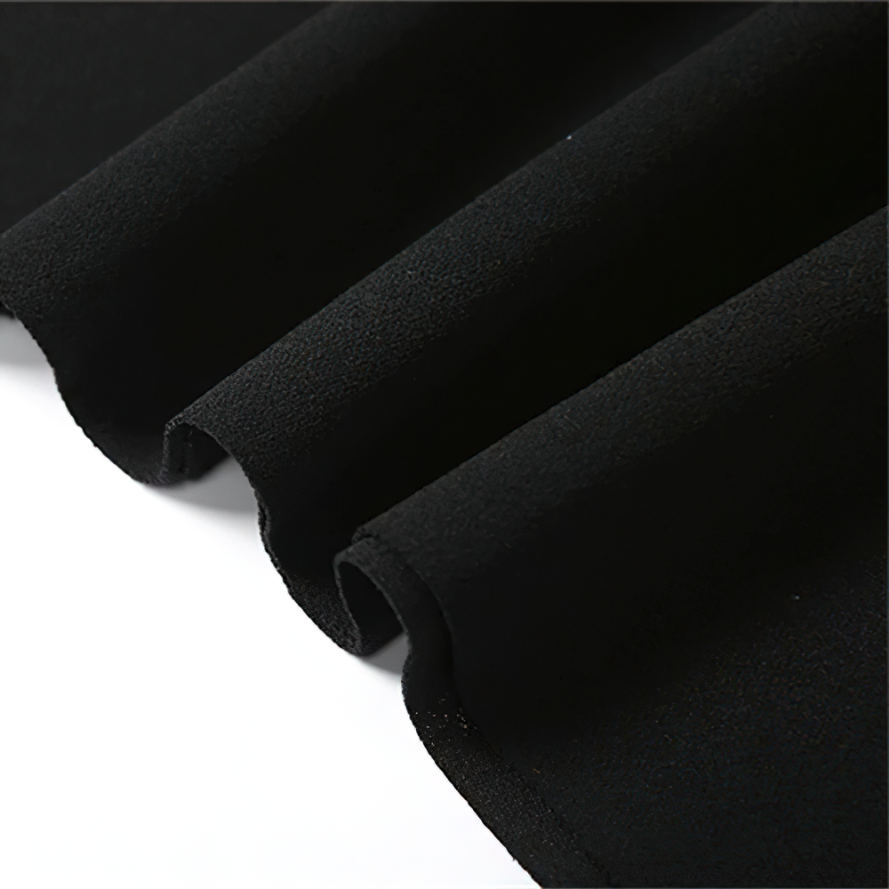 Close-up of soft black fabric showcasing the elegant texture for a women's asymmetrical strapless mini dress.