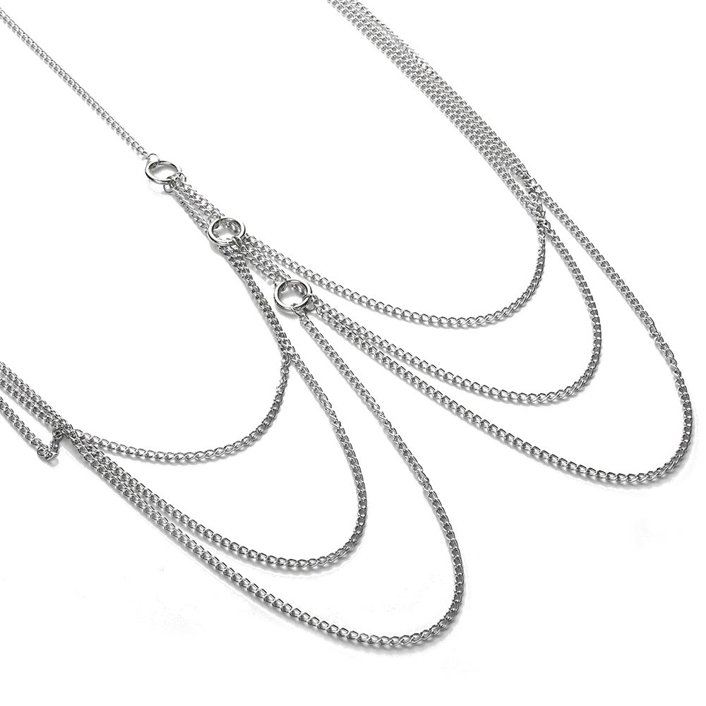 Elegant silver body chain featuring flowing aluminum links, perfect for punk or goth fashion styles.