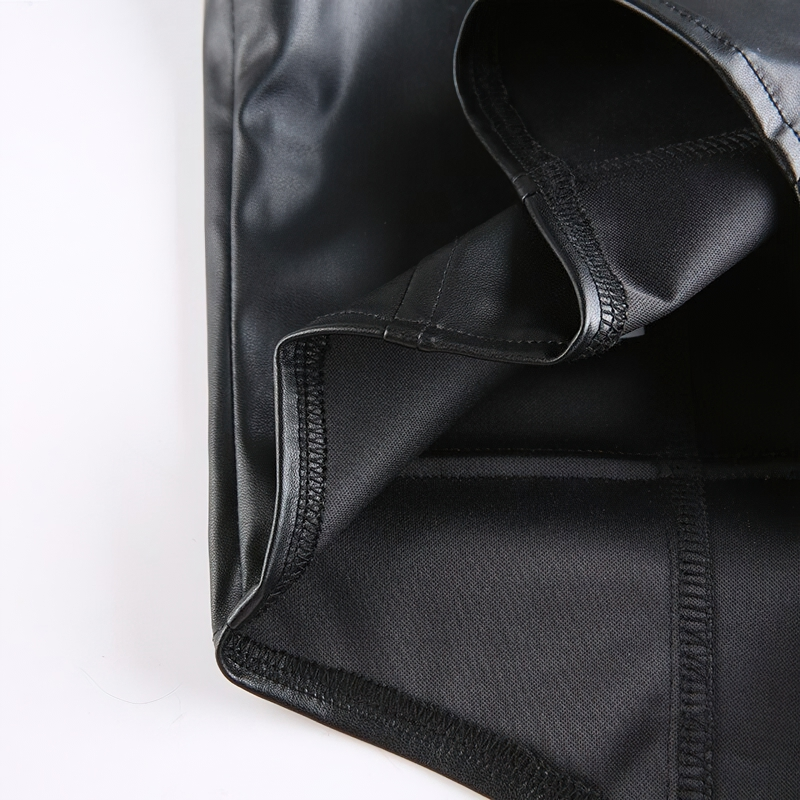 Close-up of the interior lining of a women's black PU leather cropped vest, showcasing its sleek, gothic style.