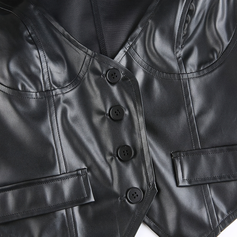 Close-up of a black PU leather cropped vest for women featuring buttons and a gothic style design.
