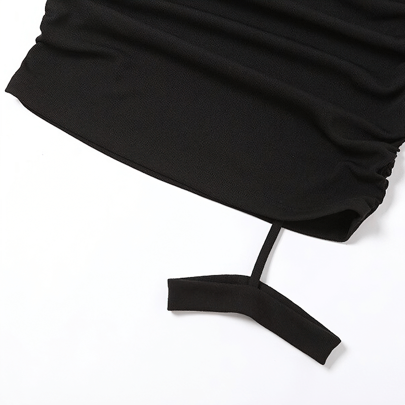 Close-up of black bodycon dress fabric showcasing garter design and stylish ruching for a gothic look.