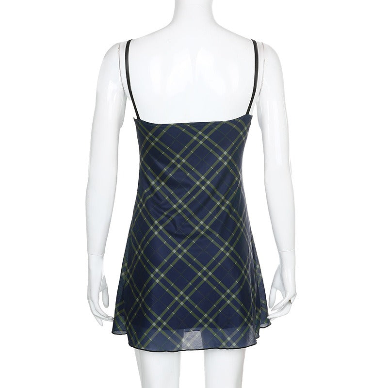 Back view of sexy bow lace-up mini dress in grunge style, featuring a plaid design and double-layer mesh detailing.