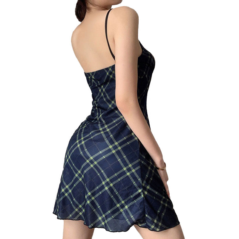 Back view of a sexy bow lace-up mini dress in grunge style with plaid pattern, perfect for trendy women.